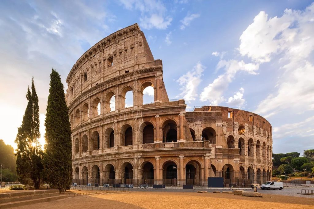 A panoramic view of the Roman Colosseum at golden hour