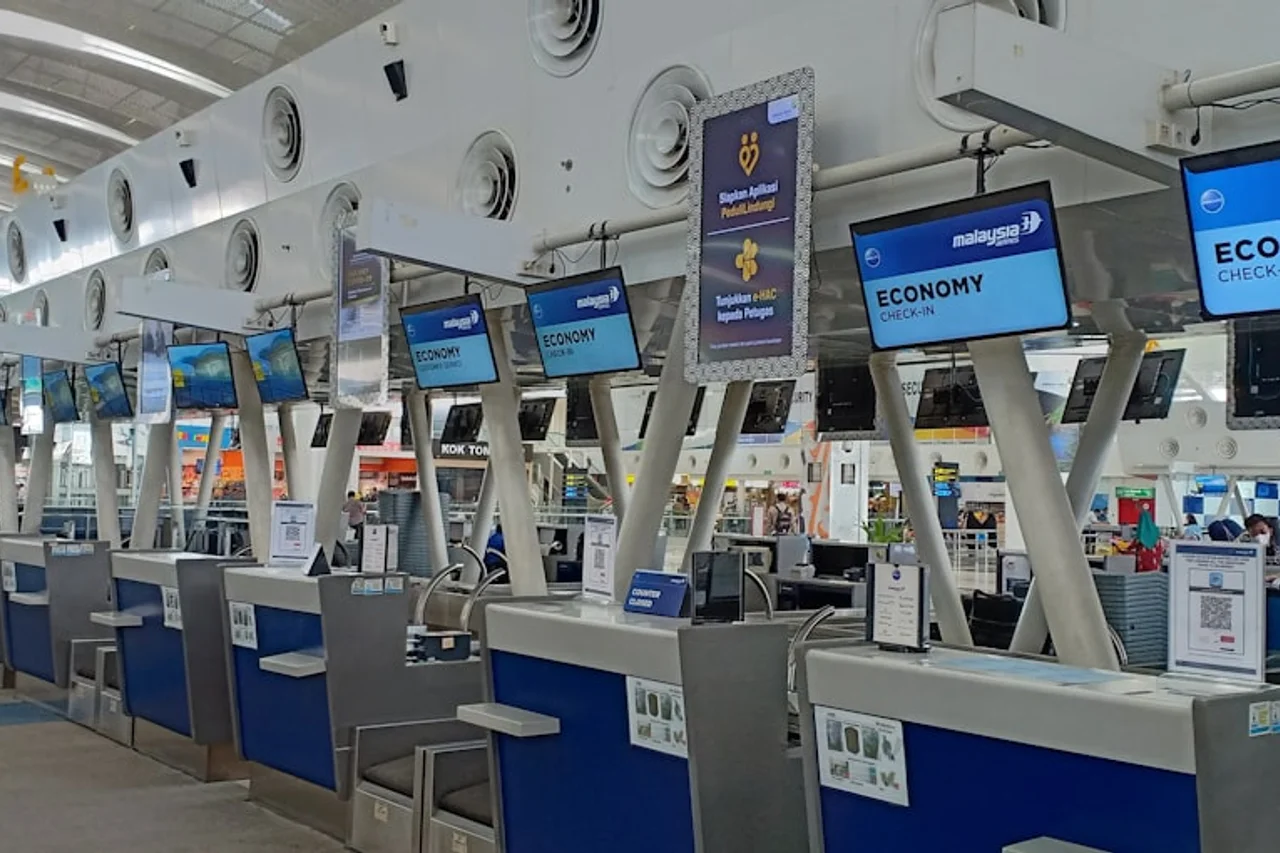 Traveller verifying their Ryanair booking at an airport desk.