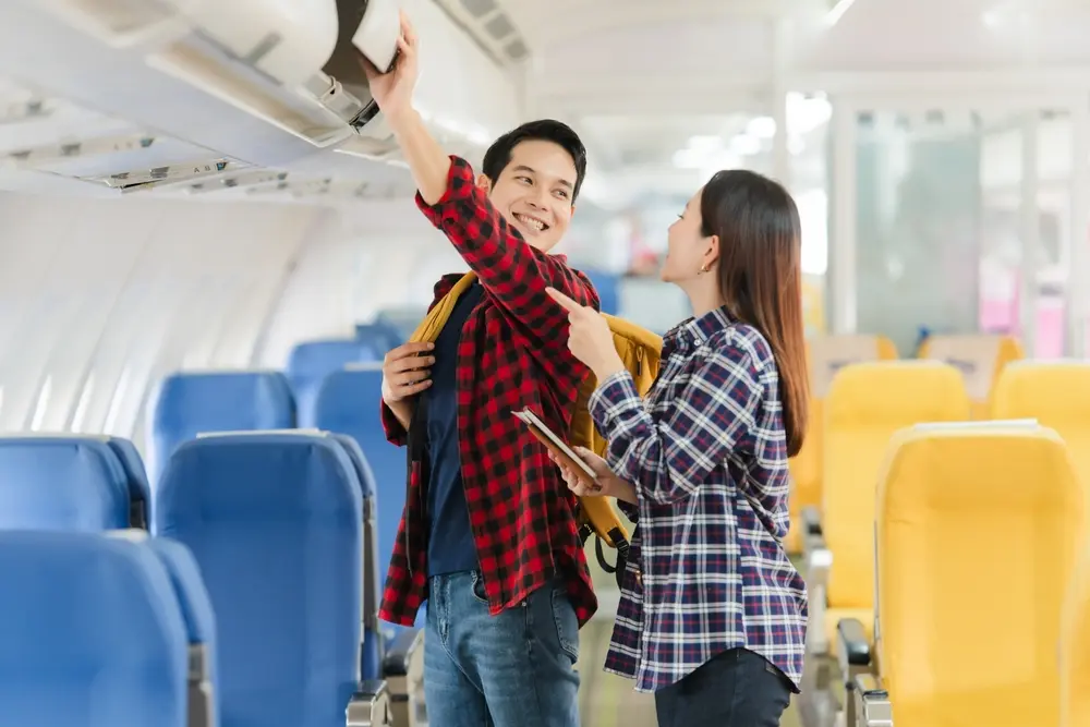 Helping with a suitcase in the overhead locker