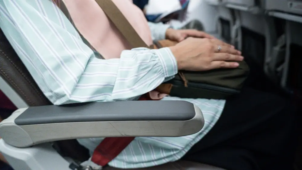 Sharing an armrest on an airplane