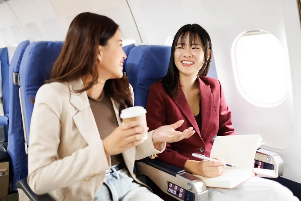 Passengers talking on a flight